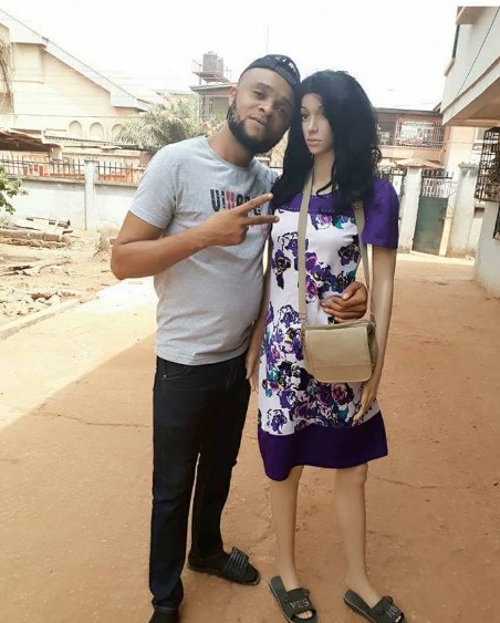 Nigerian man kneels to propose to his mannequin sex doll