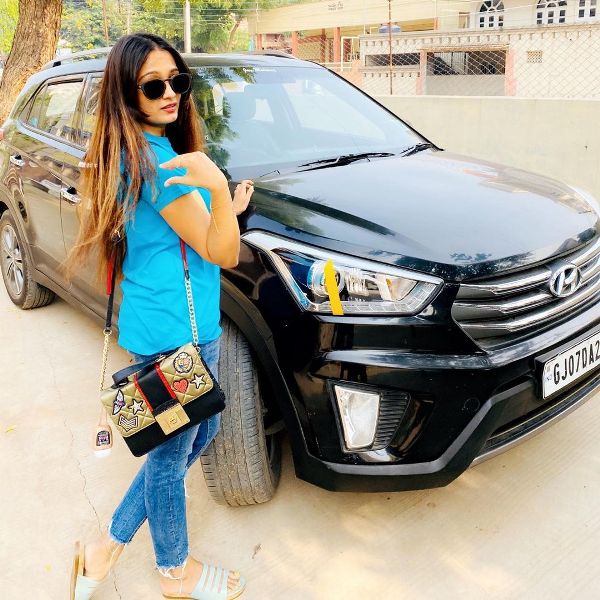 Meha Patel with her car 