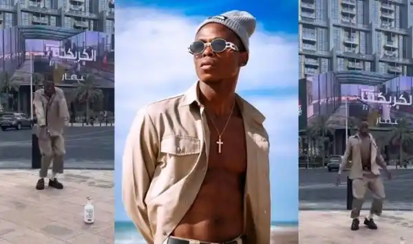 Shirtless Toss obeys Dubai rules (Video)